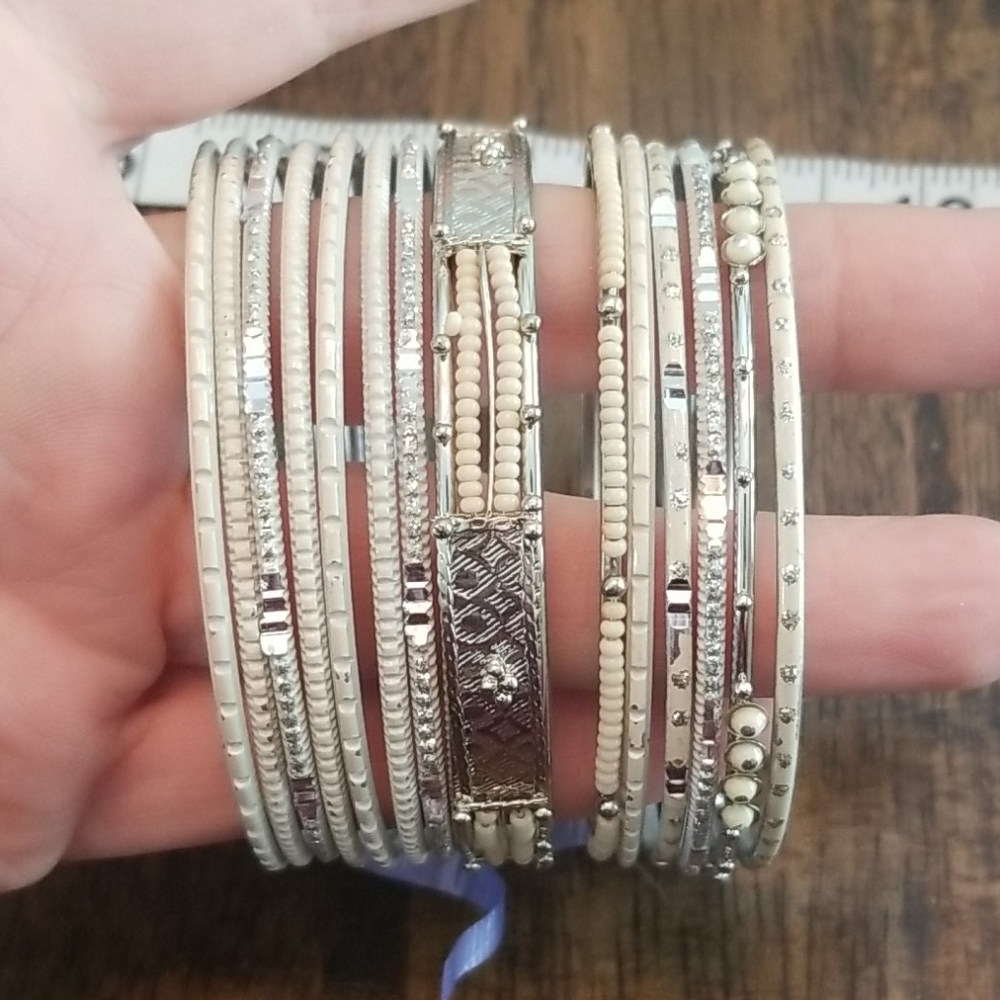 Set of 14 silver and cream bangles